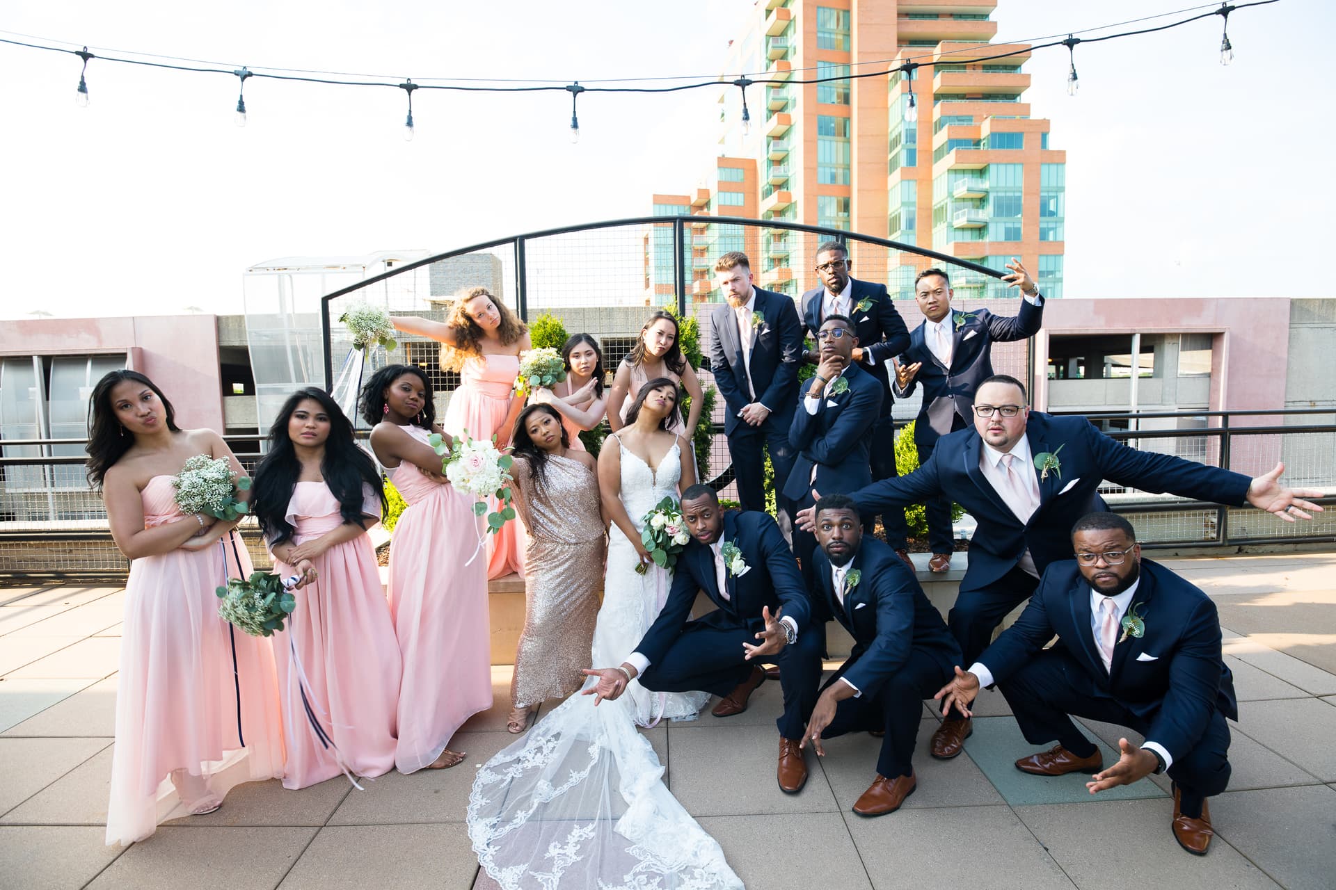 Bridal party posing like they're on a hip hop album cover.