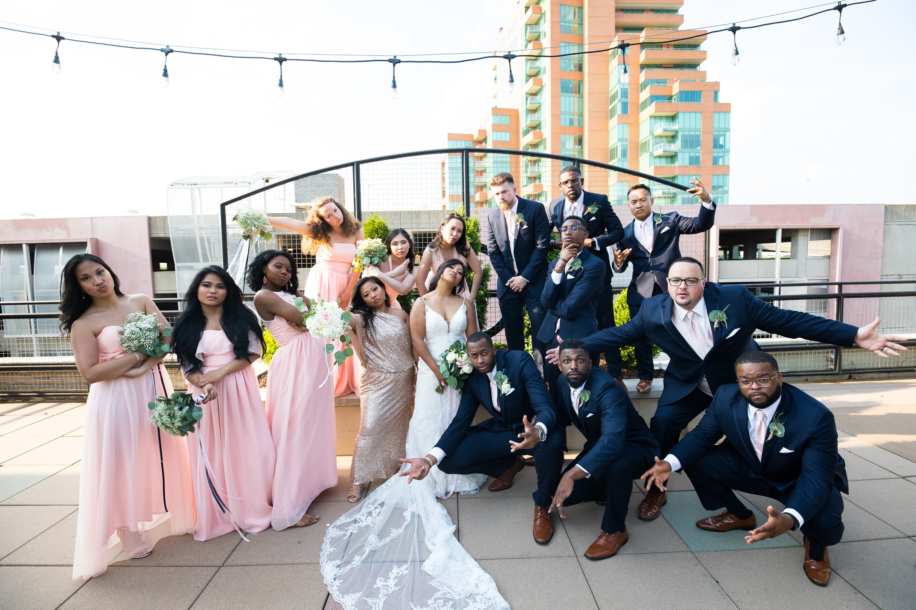 Bridal party posing like they're on a hip hop album cover.